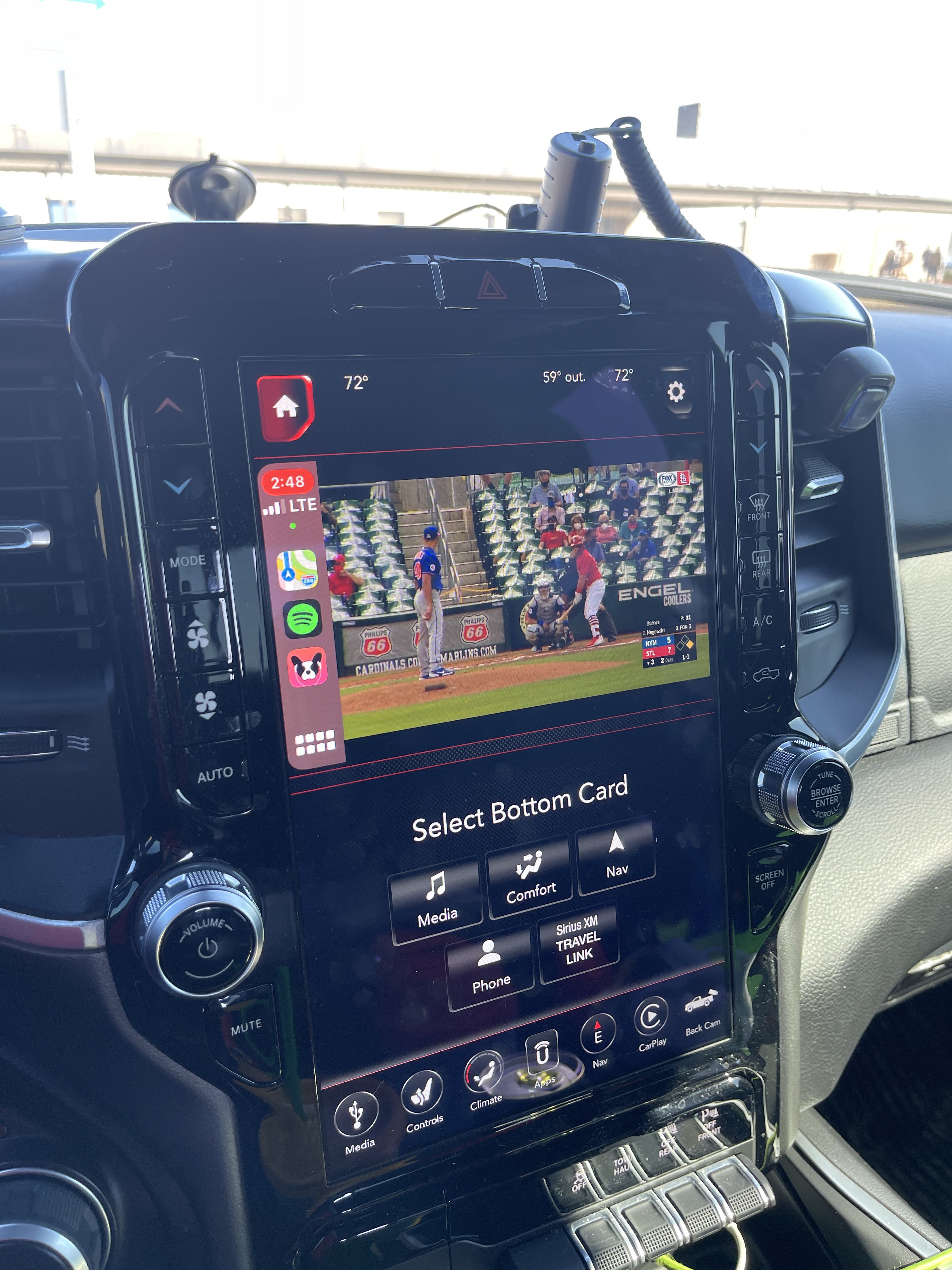 A user watching a sports game on CarPlay